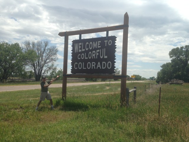 It's hard to tell, but I'm wearing my "Got Peart?" t-shirt.  And, there's a big, big train in the background.  Andy's motorcycle is missing, however.