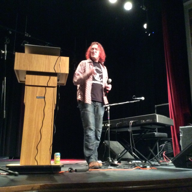 Tillison, lecturing on the transformation of the protest song in a world of Facebook and Twitter.